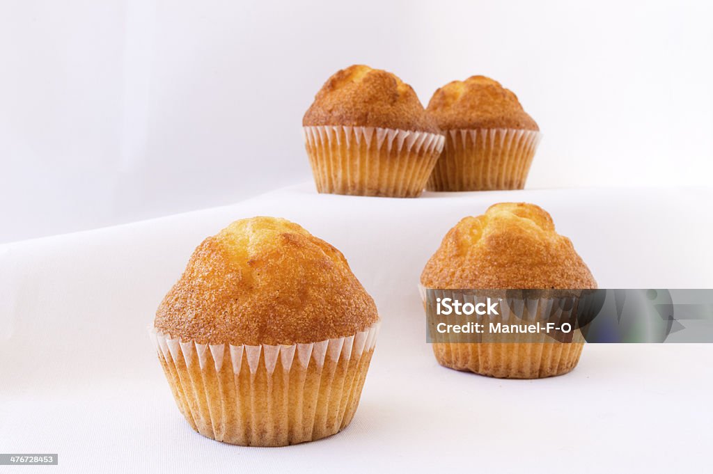 pile of muffins pile of muffins on a white background Baked Stock Photo