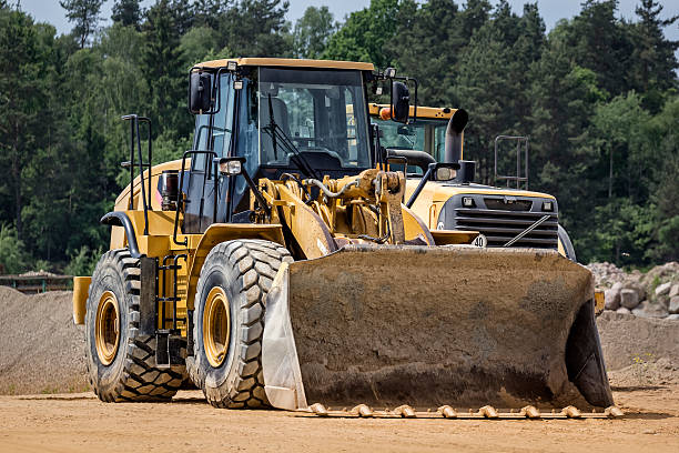 istock Earth movers in a new road construction 476728988