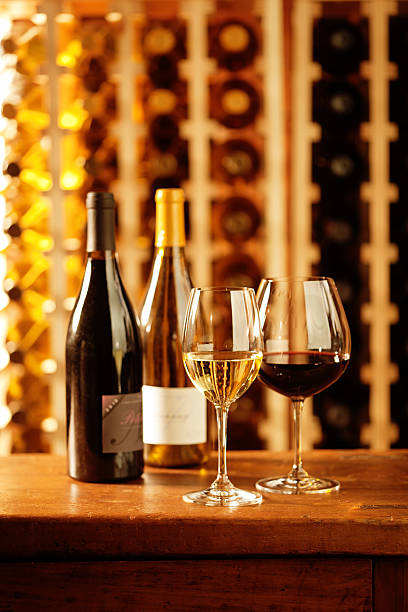 istock Wine Glasses, Bottle and Racks in Cellar Vertical 476729161