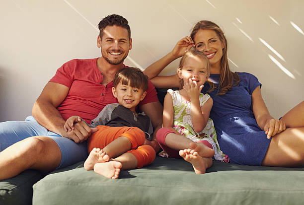 istock Happy young family relaxing on patio 476729678