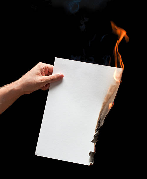 Man hand holding white burned paper Man hand holding white burned paper crumpled paper photos stock pictures, royalty-free photos & images