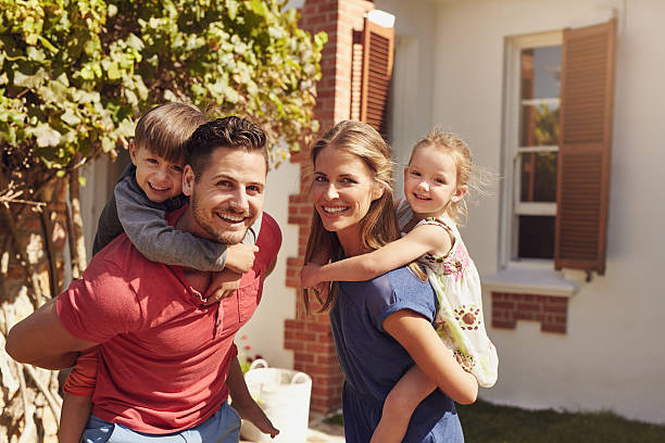 istock Happy couple carrying children on their backs 476733482
