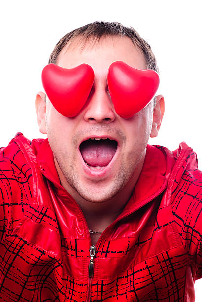 istock Man with red heart-shapes 476734681