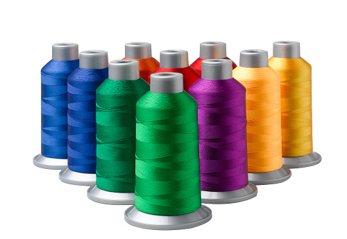 Colourful of cone threads arrangement on white background the textile from the nature