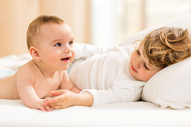 istock Cute little brothers enjoying in bedroom. 476736432