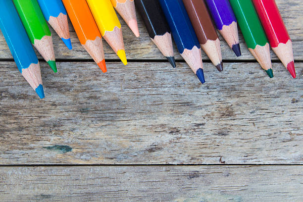 istock color pencils on wood plank, top view 476737136