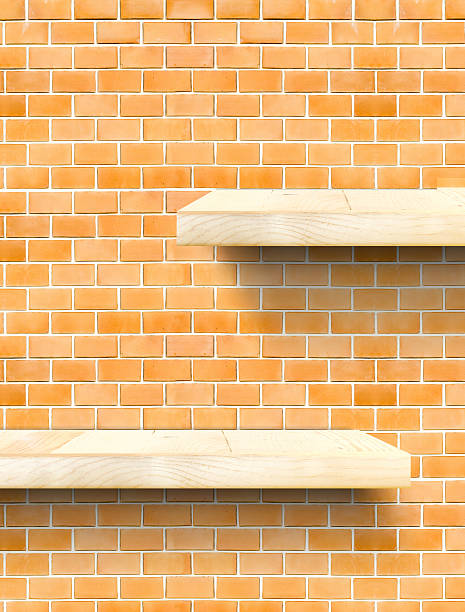 istock Empty Wooden Table top and shelf at orange bricks wall 476738428