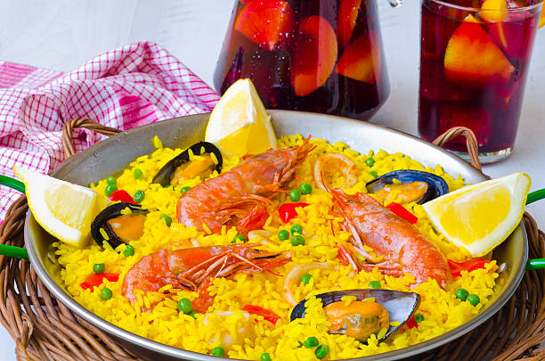 Spanish Cuisine. Paella and fresh sangria. stock photo