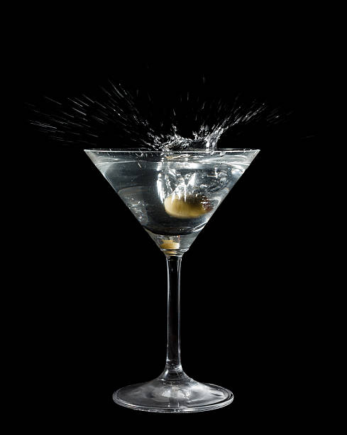 istock Olive dropped in a cocktail glass with liquid 476739398