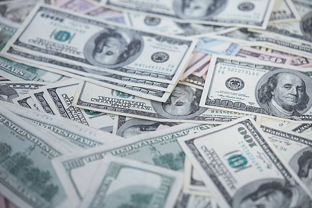 istock money in a chaotic manner on the floor 476739900