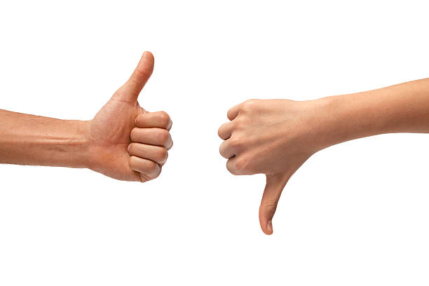 Thumb up and down hand signs stock photo