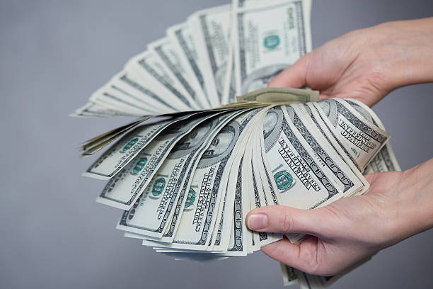 istock Money in female hands 476740296