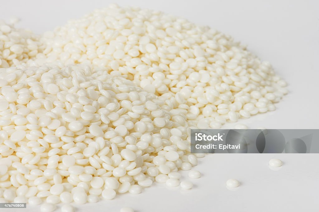 White polymer granules Heaps of fine white polymer granules isolated on white background 2015 Stock Photo