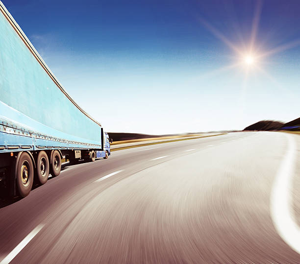 istock Highway traffic in sunset near fields 476740832