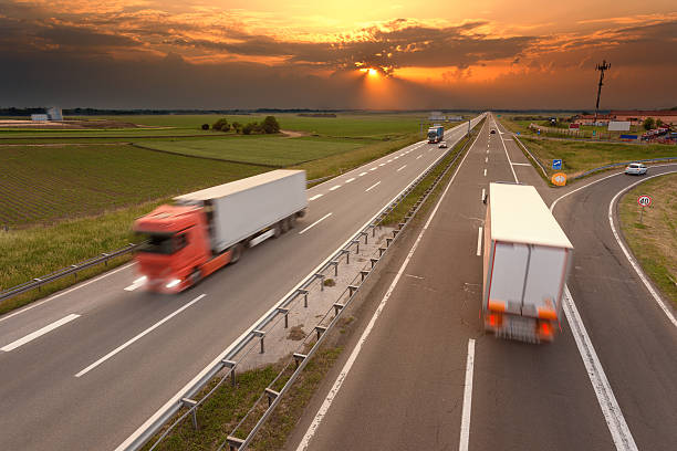 istock Many trucks in motion blur on the highway 476742820