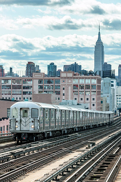 istock Subway Train Speeding on Elevated Track in Queens, New York 476743486