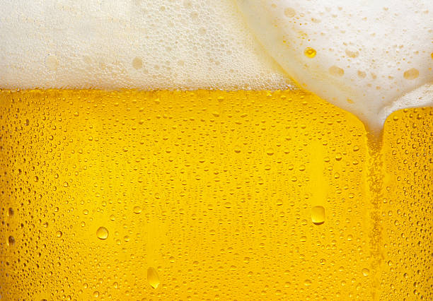 Beer texture Droplets on freshly poured beer beer stock pictures, royalty-free photos & images