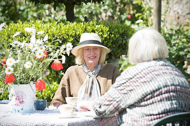 istock Senior women enjoying afternoon tea together 476746830