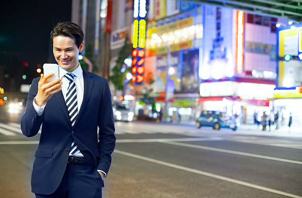 istock Asian businessman answering mobile phone 476747126