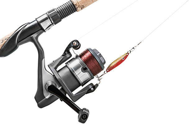 istock Fishing rod and lure isolated on white 476747462