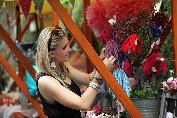 istock young market trader displays merchandise 476752287