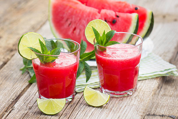 istock Two glasses with watermelon smoothies with lime and mint 476752614