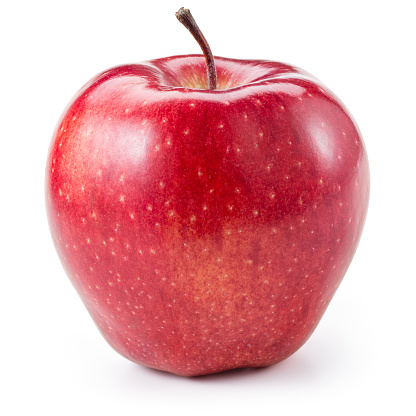 Stock photo showing close-up view of a red apple on top of a group of green Granny Smith apples with shiny, speckled skin.