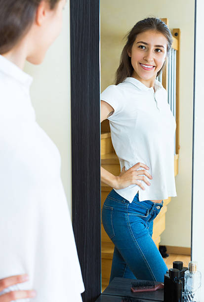 istock Young girl trying on a t-shirt 476753344