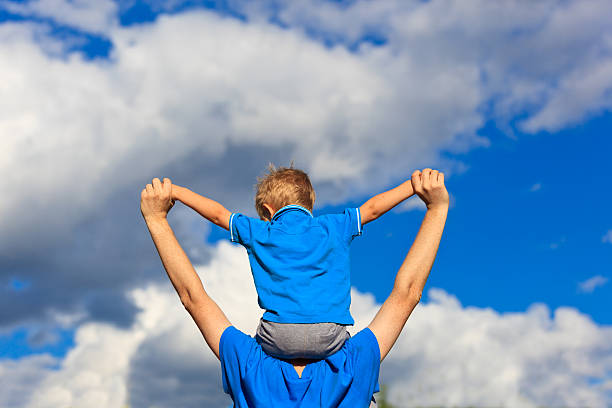 istock happy family with the sky on background 476755031