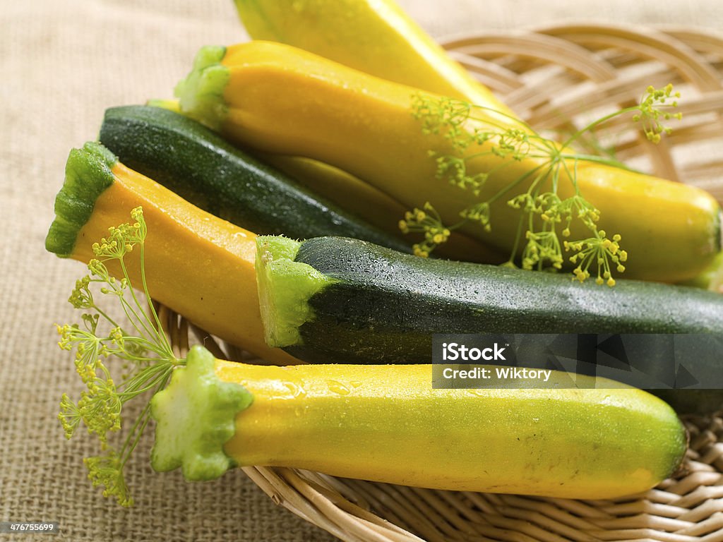Fresh zucchini Fresh zucchini  (or courgette) in a basket, selective focus Zucchini Stock Photo