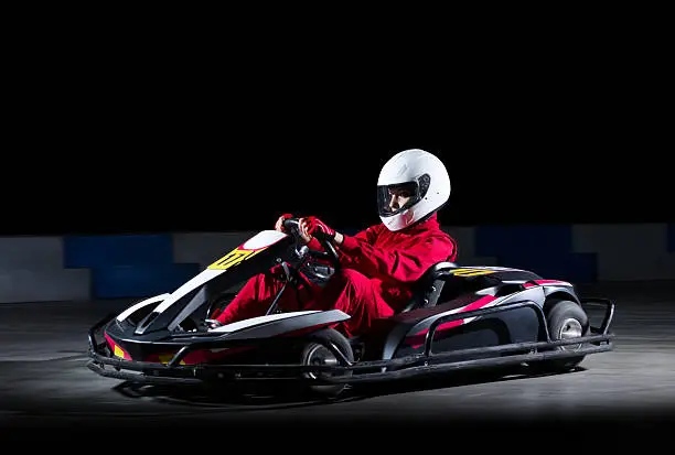 Young girl karting racer isolated