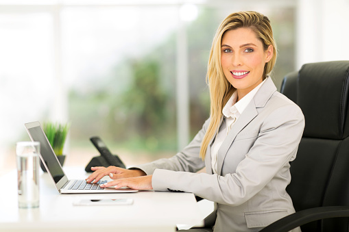 beautiful businesswoman using laptop computer in office