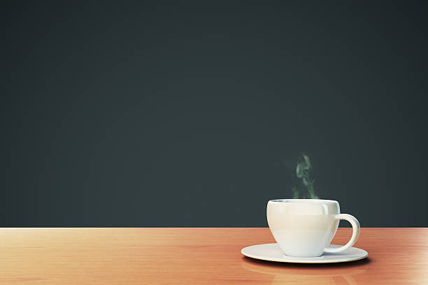 istock cup of coffee on a wooden table with copyspace 476761552