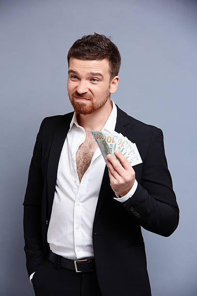 istock businessman with money 476761920