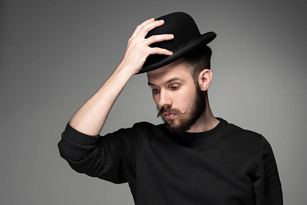 istock Young man raising his hat  in respect and admiration for 476762942