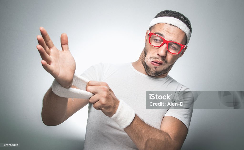 Funny sport man Lazy young man does not wish to doing fitness - exercising. 2015 Stock Photo