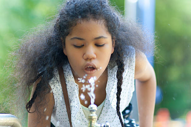 istock Girl is drinking water 476763418