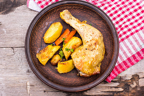 istock Baked chicken and potatoes 476763492