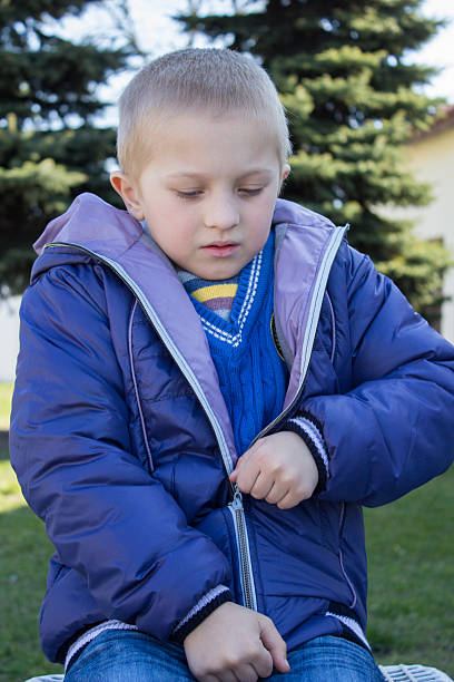 istock boy wearing a jacket with a zipper 476763992