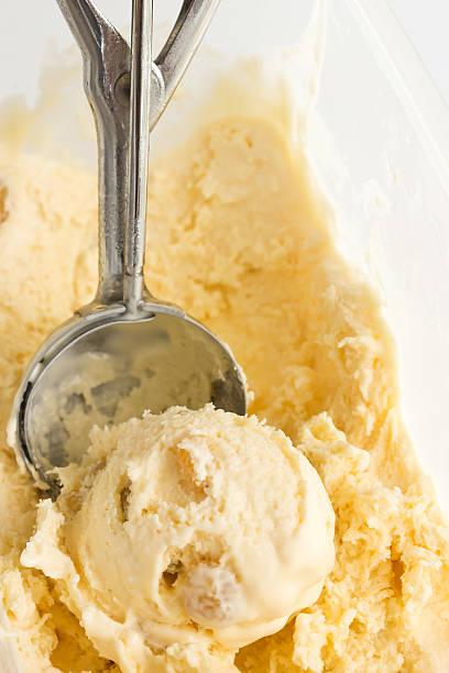 istock Rum raisin icecream in a box with scooper. 476765004