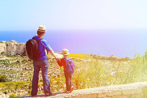 istock father and little son travel in mountains 476765372