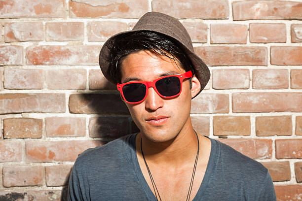 istock Urban asian man with red sunglasses. Good looking. Cool guy. 476766831