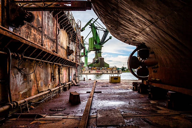 On the dry dock Industry view - On the dry dock in shipyard Gdansk, Poland. dry dock stock pictures, royalty-free photos & images