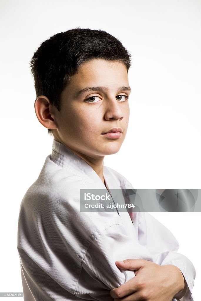 karate a child with his arms folded wearing his karate uniform. Arms Crossed Stock Photo