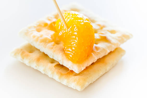 slices of mandarin with cookies stock photo