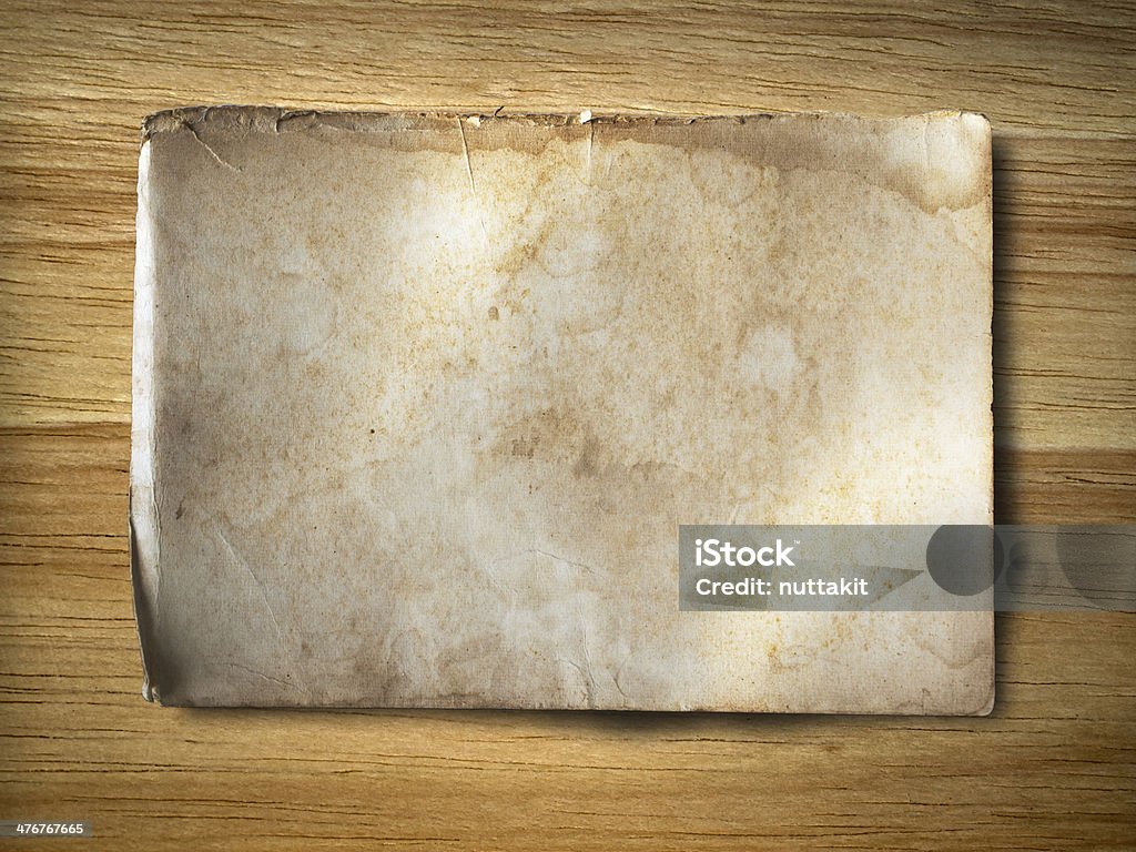 old grunge paper on wood old grunge paper on rubber wood background Backgrounds Stock Photo