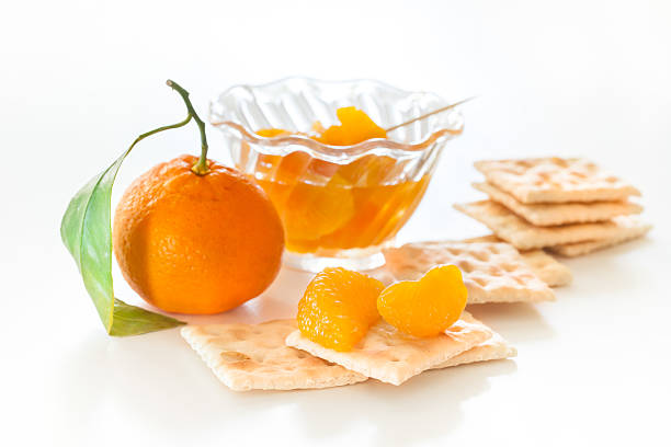 Slices of mandarin with cookies stock photo