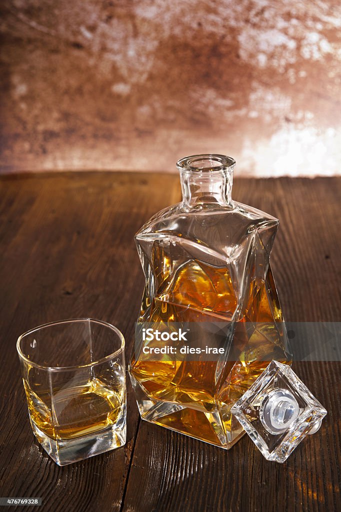 Whiskey decanter Decanter and glass of whiskey Film Noir Style Stock Photo
