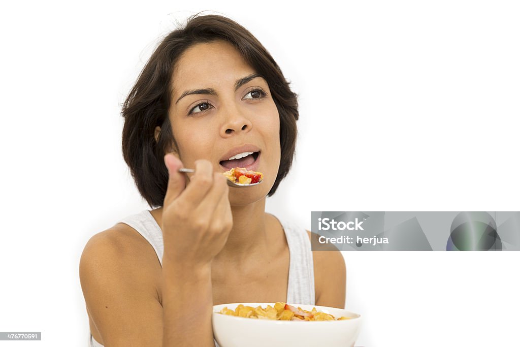 Attractive woman having breakfast Smiling attractive woman having breakfast in kitchen interior Adult Stock Photo