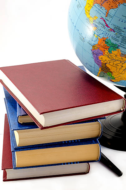 istock books and the globe on a white background 476771155